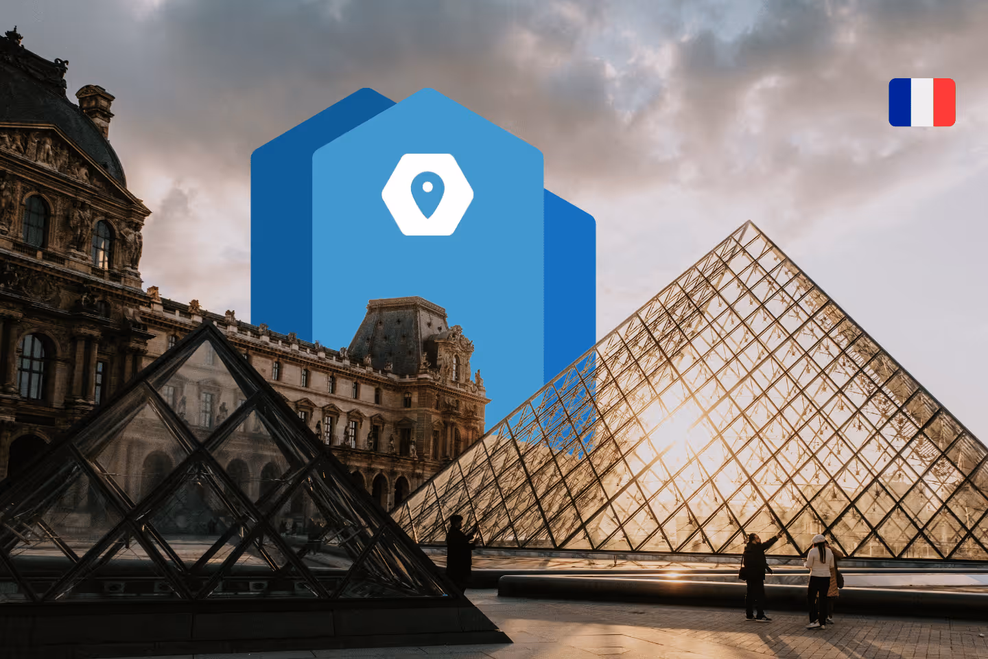 Outside the Louvre Museum in Paris, France and Jobbatical logo