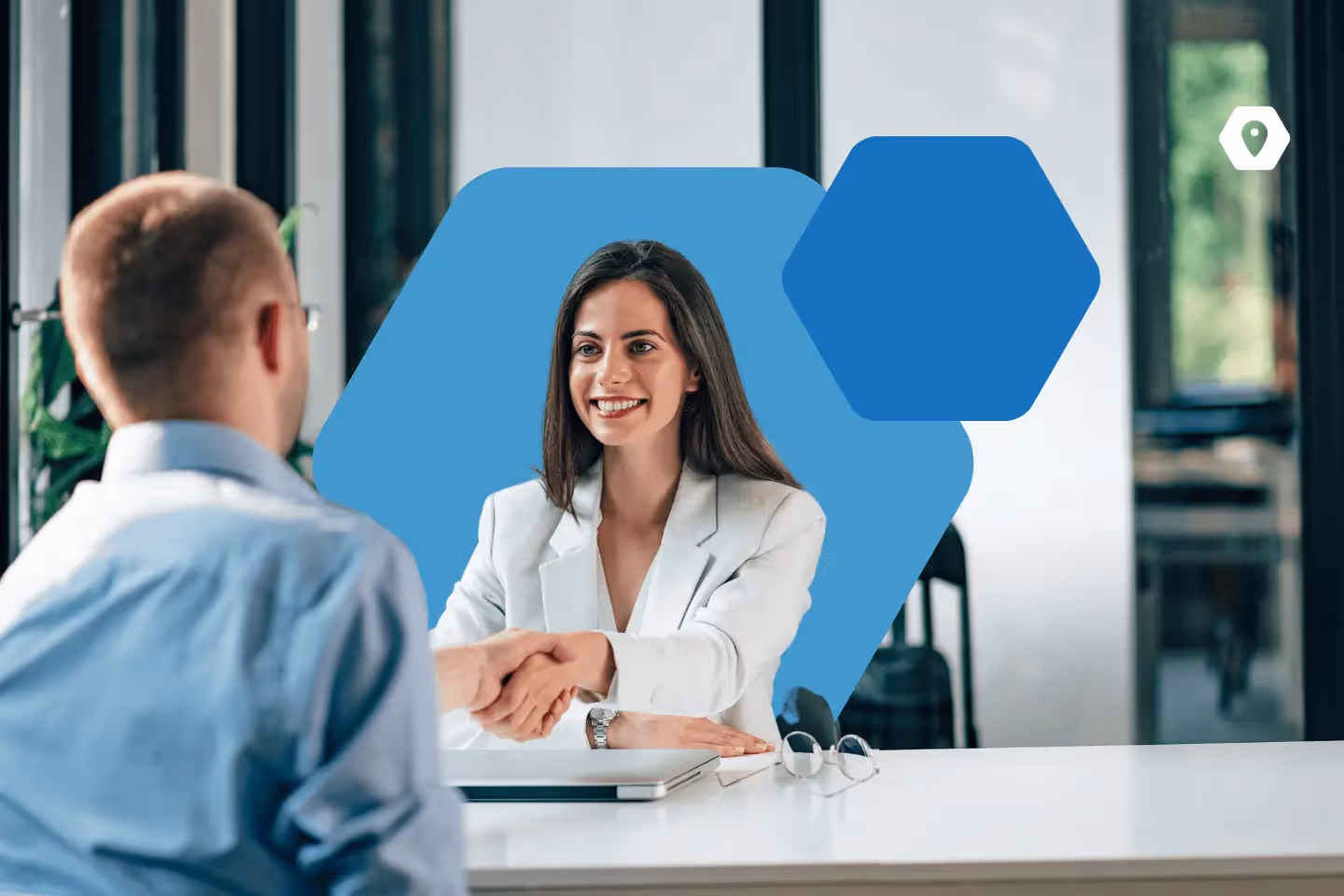 Female HR professional shaking hands with candidate