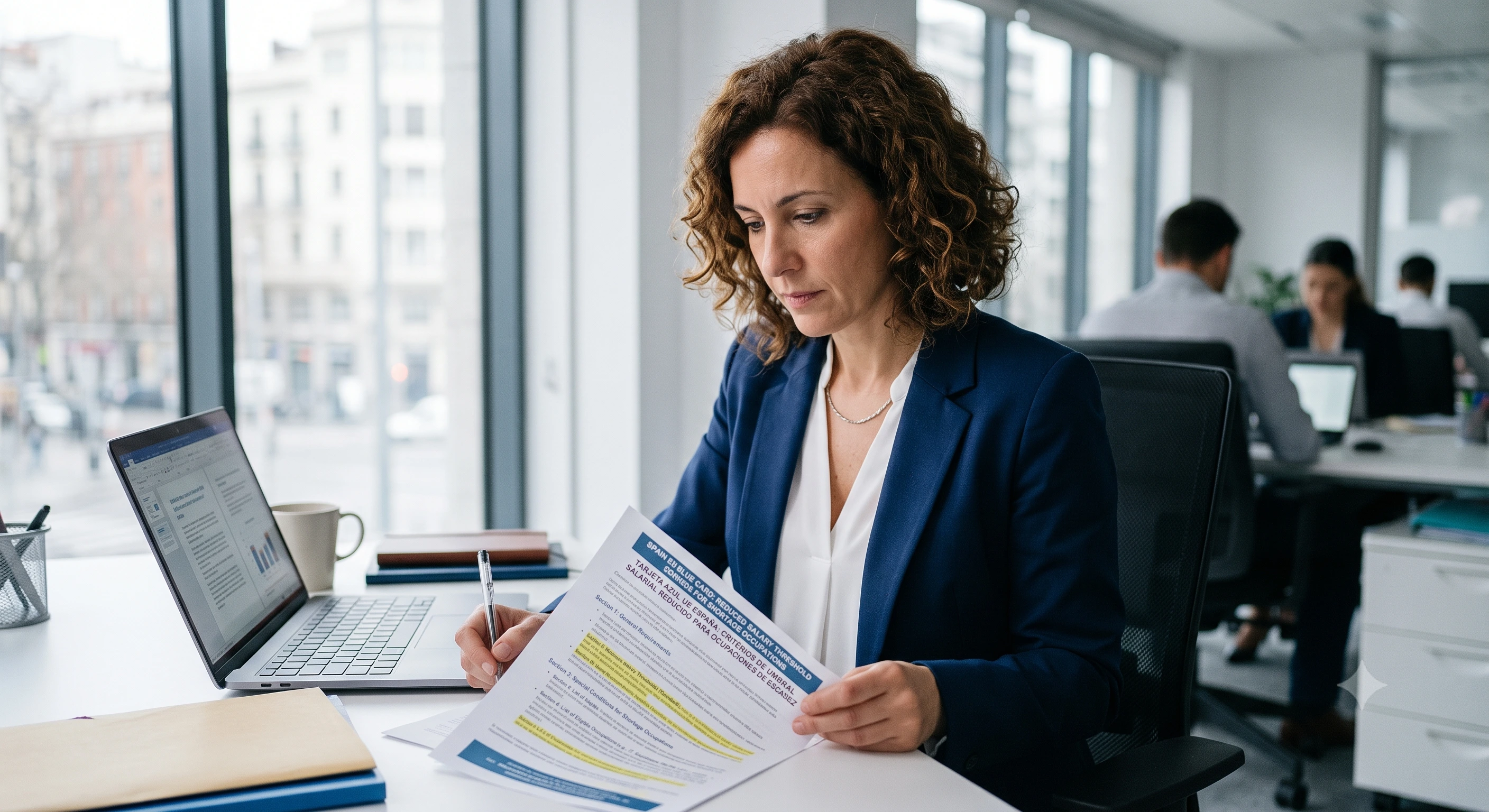 HR manager reviewing Spain EU Blue Card reduced salary threshold criteria for shortage occupations