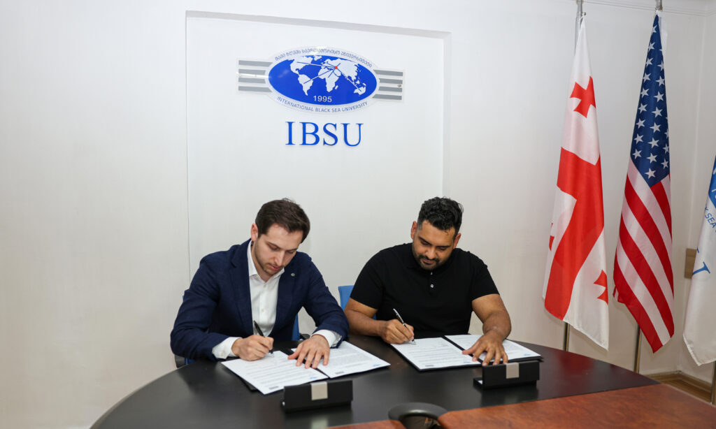IBSU and 2080 Ventures representatives sign their MOU.