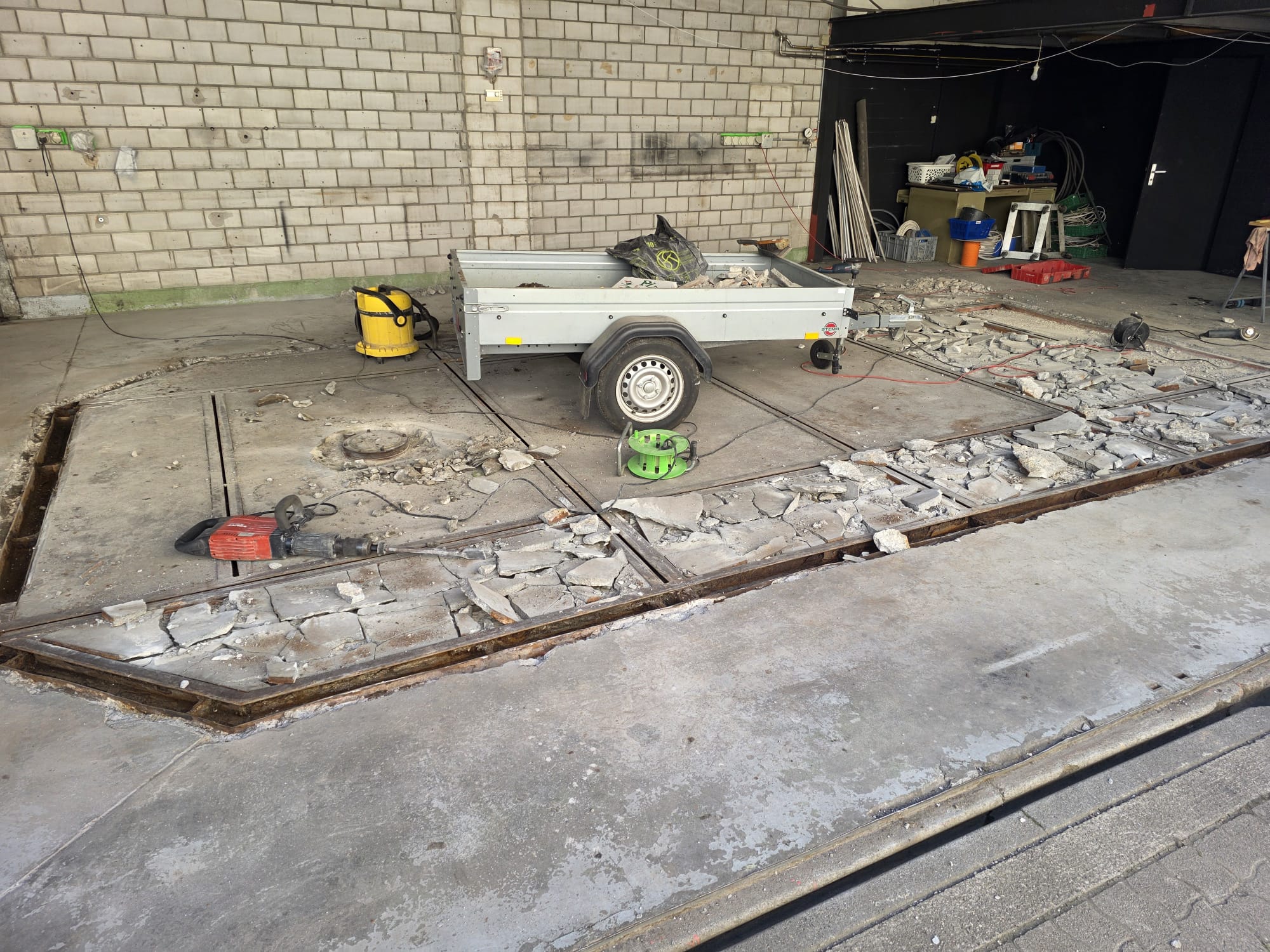Demolition work on the workshop floor using a jackhammer