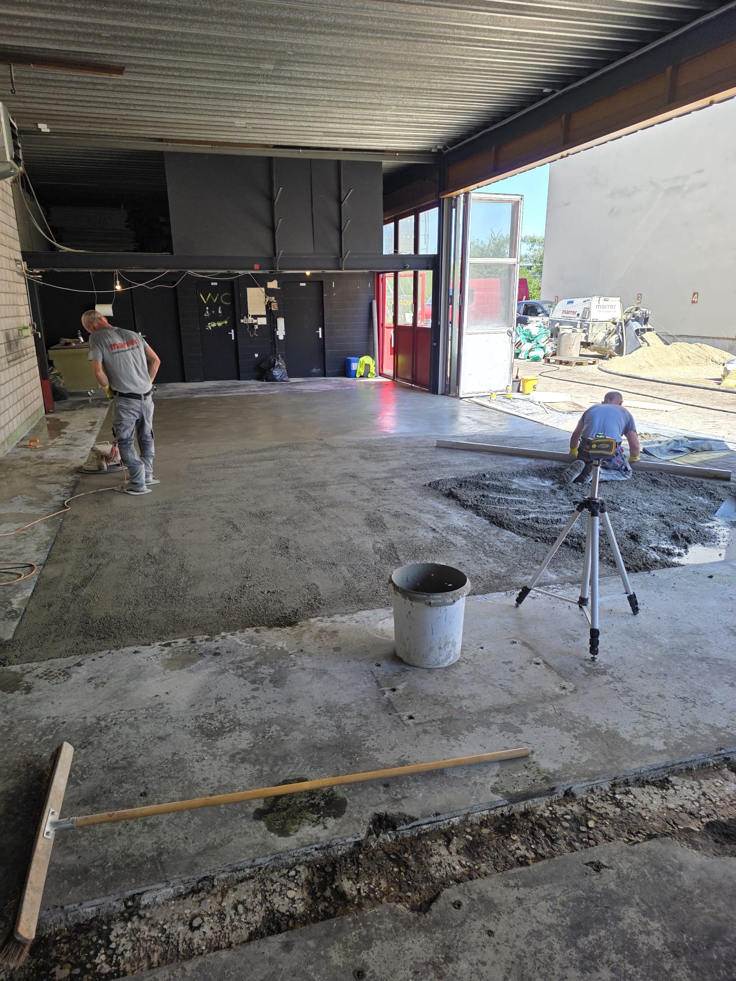 Pouring the concrete for the new workshop floor