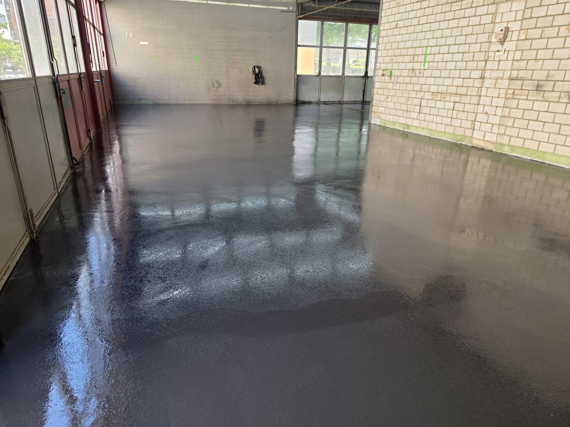 The freshly sealed floor of the new workshop
