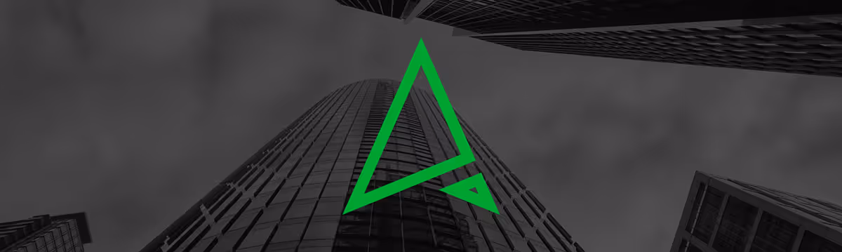 Black and white picture of an office building as the background with the ProcureTech Logo in the front