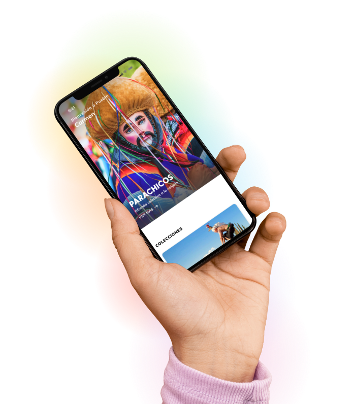 Phone in hand showing Pueblo App
