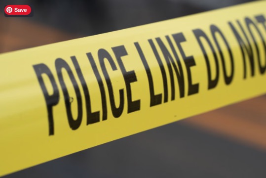 A yellow police line "do not cross" tape., image