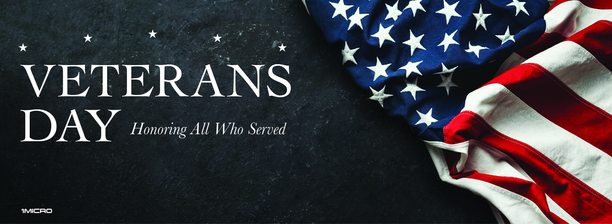 American flag on a black stone background with the text "Veterans Day. Honoring all who served." .,image