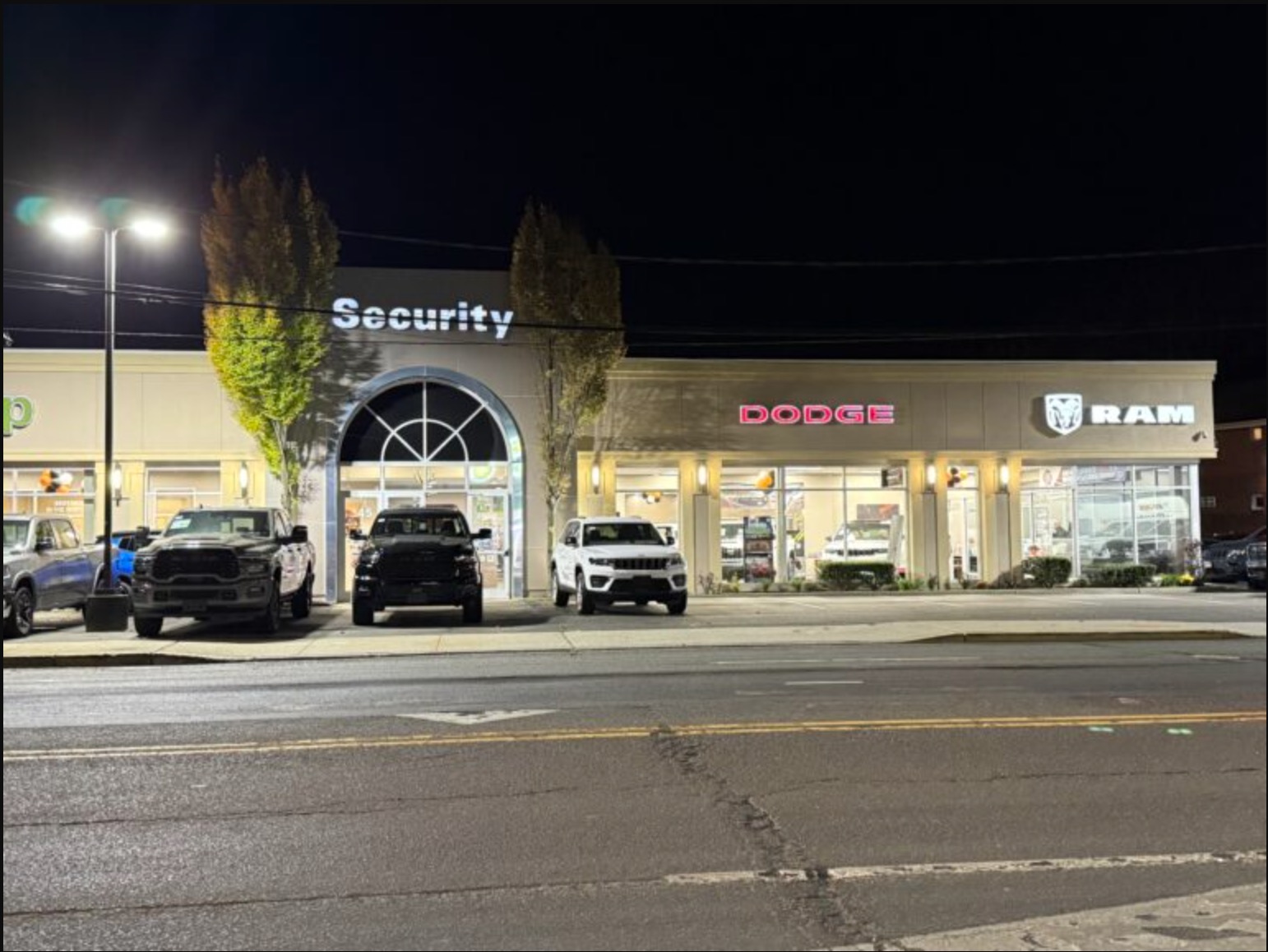 A night time exterior shot of the Dodge dealership., image