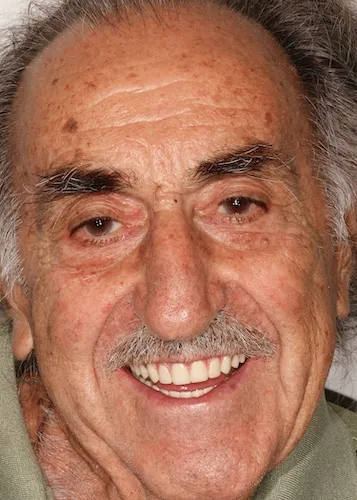 A man with a warm smile on his face, radiating happiness with his new smile.