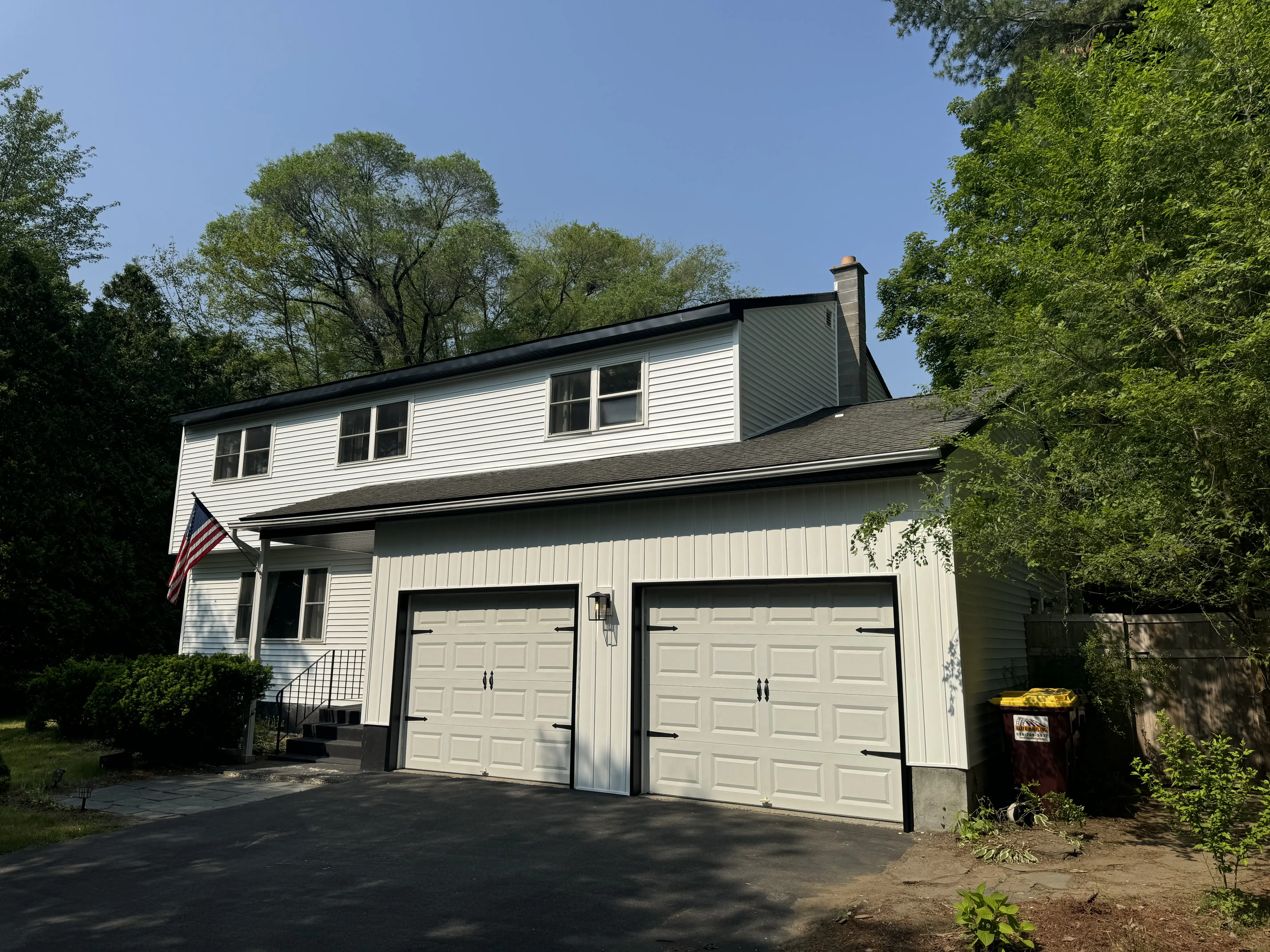 Another angle of a white vinyl siding job taken from the front. 