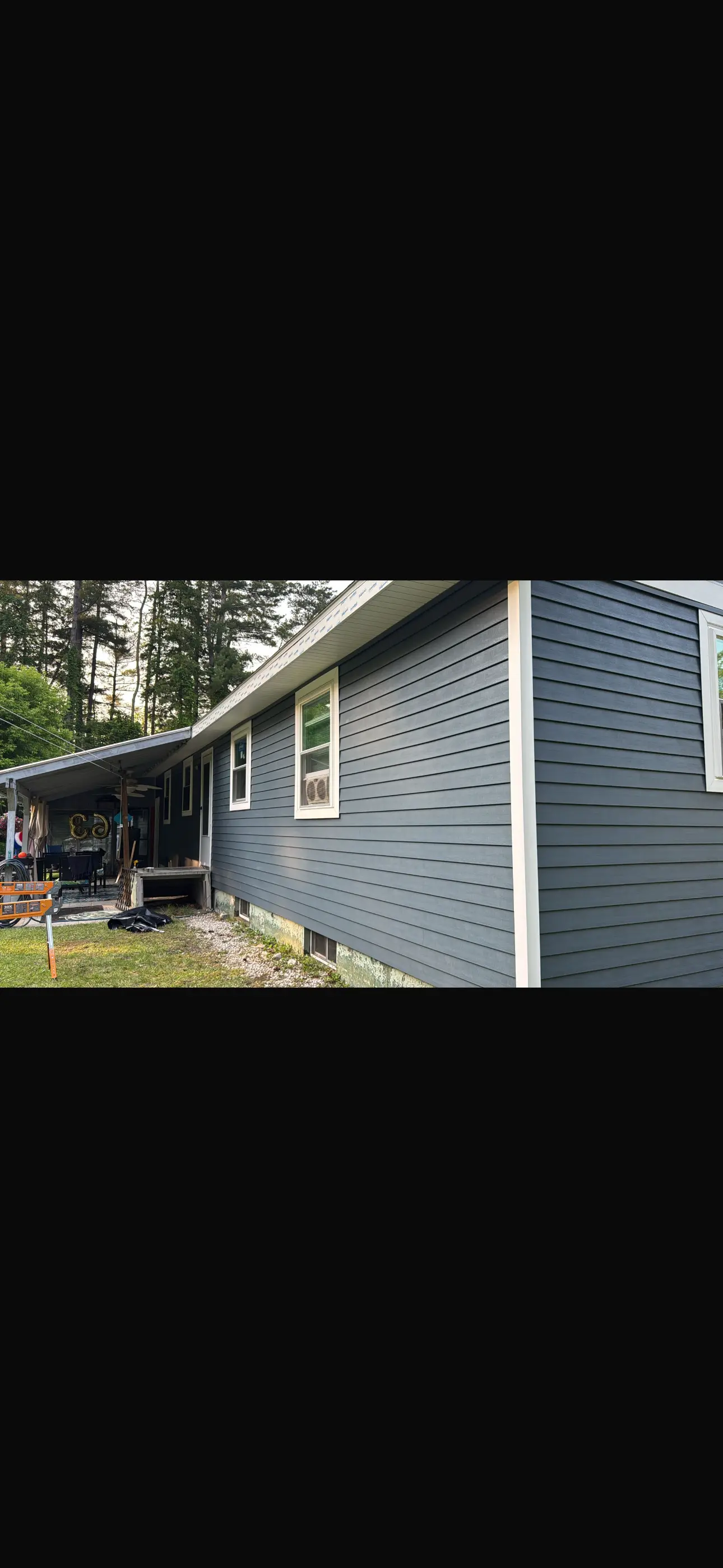 a house with a porch and a lawn