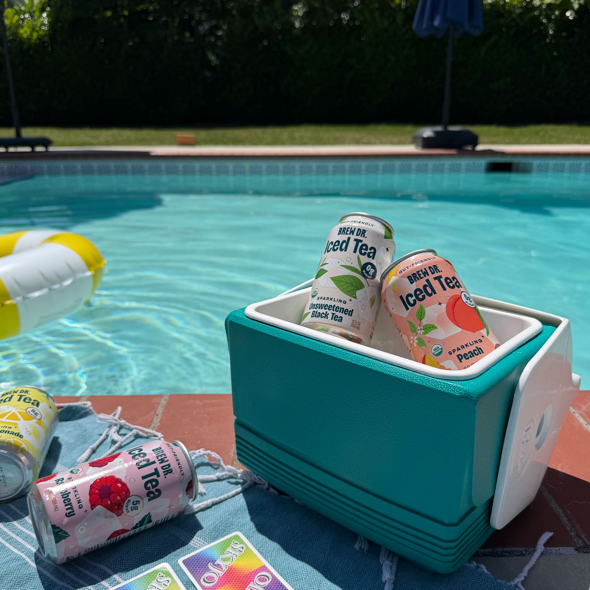 Brew Dr. iced tea cans poolside