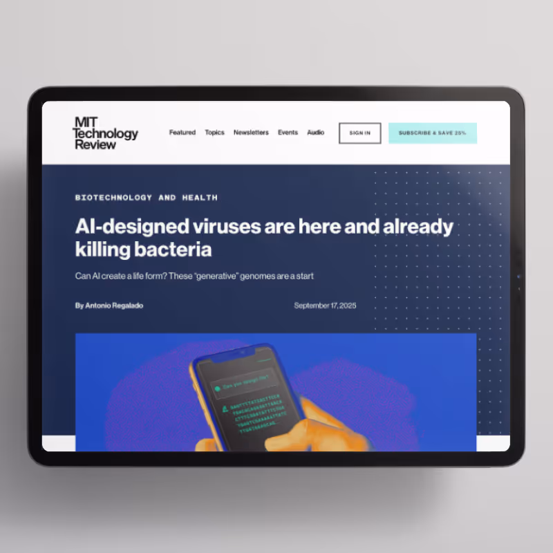 Tablet screen showing MIT Technology Review article titled 'AI-designed viruses are here and already killing bacteria' by Antonio Regalado, dated September 17, 2025.