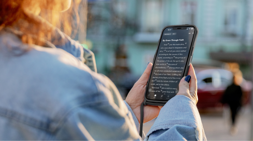 A person looking at a bible study passage on their phone