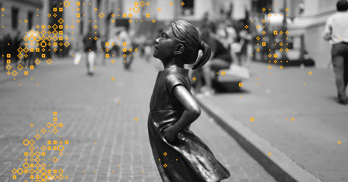 A black and white photo of the Fearless Girl statue on Wall Street in NY