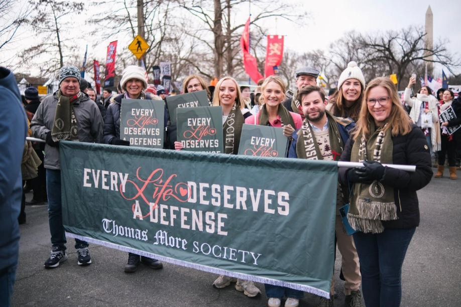 A group of people holding bannersAI-generated content may be incorrect.