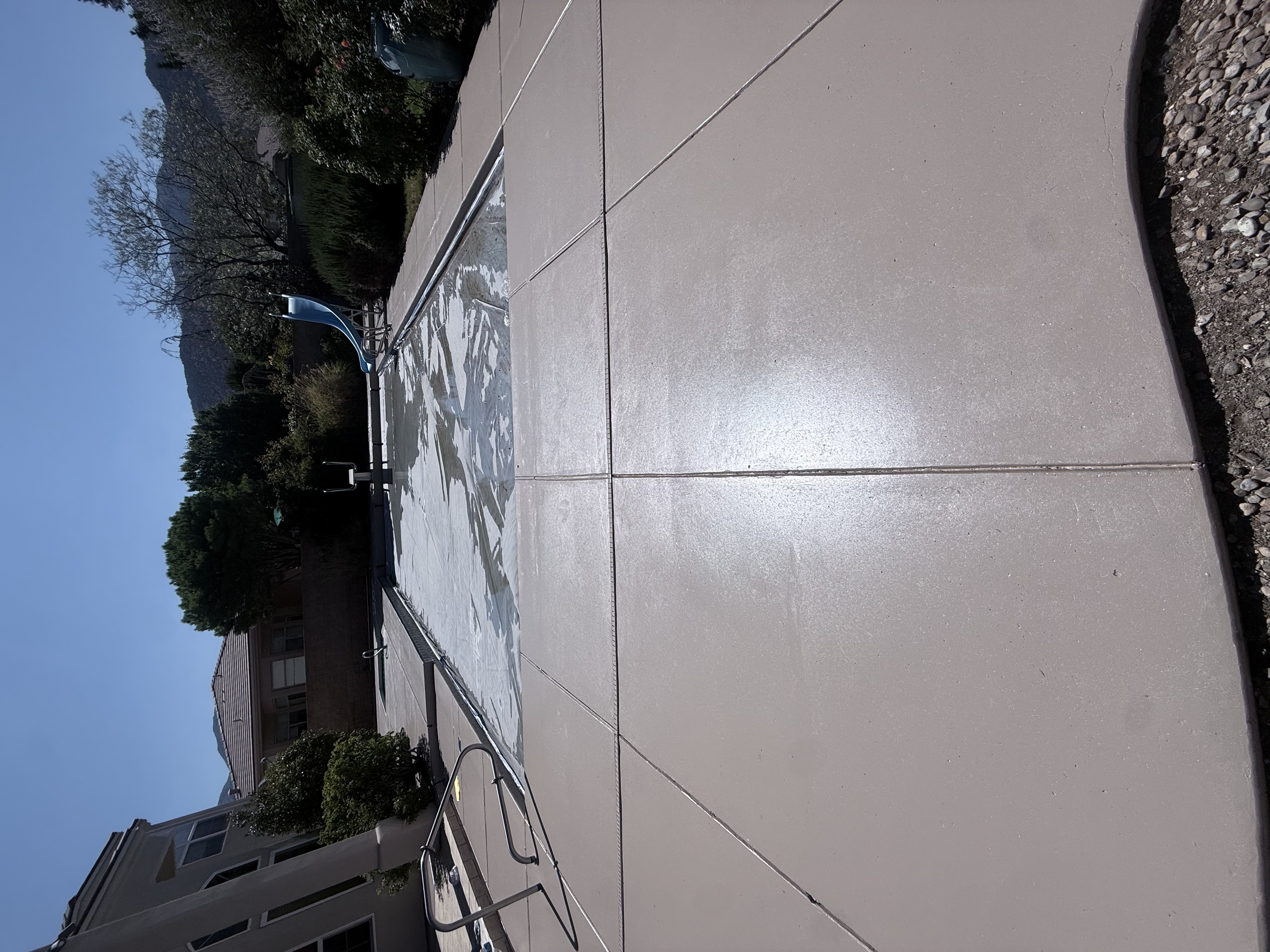 Concrete pool deck refinished and resurfaced.