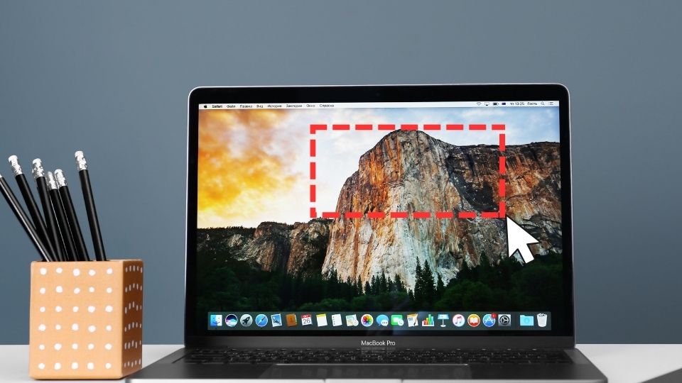 A cursor screen grabbing a mountain on a macbook desktop.