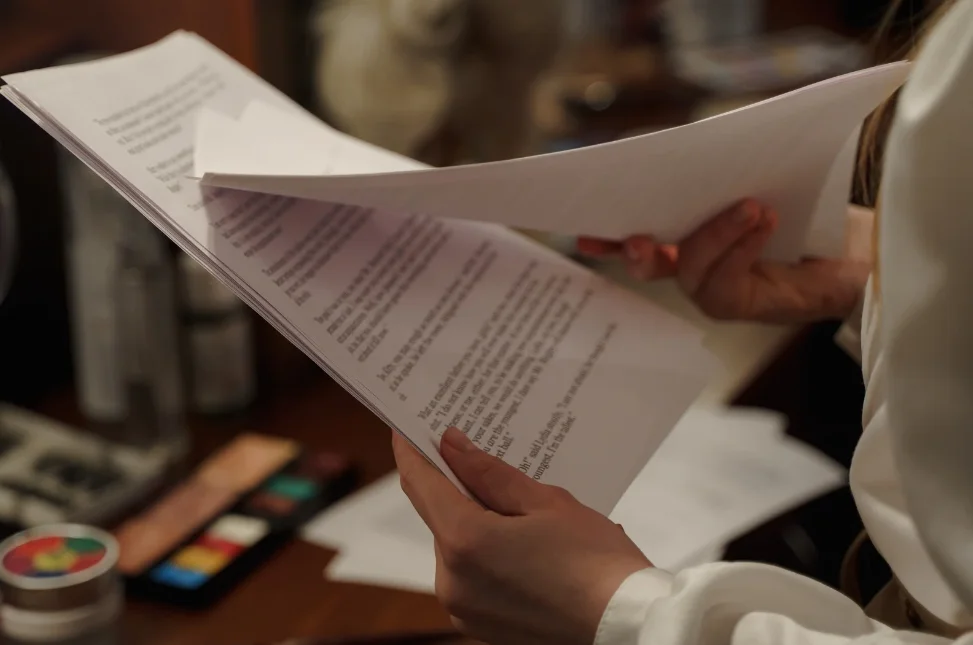 A person flipping through papers