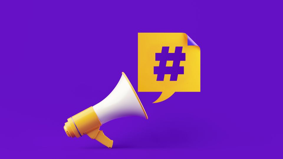 A yellow megaphone with a hashtag coming out of it in front of a purple background.