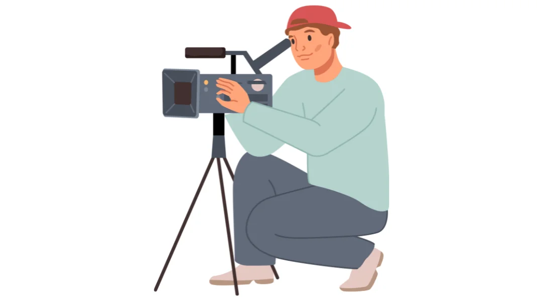 A man holding an audio and visual camera on a tripod.