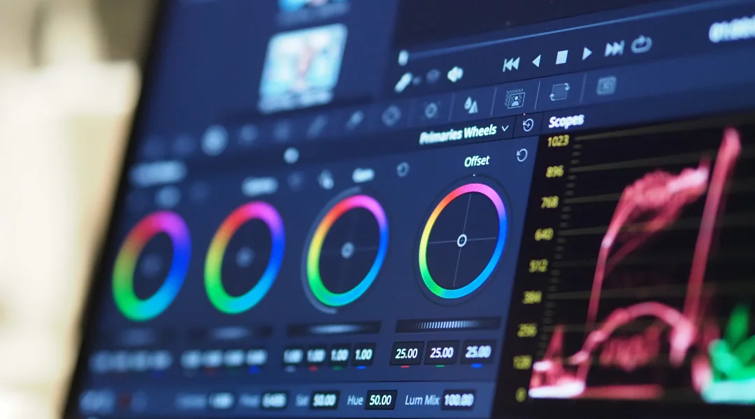 Color grading wheels on a PC monitor from a video editing software