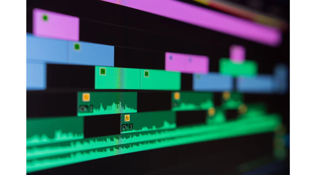 Close up of Adobe Premiere Pro editing software with neon colored clips