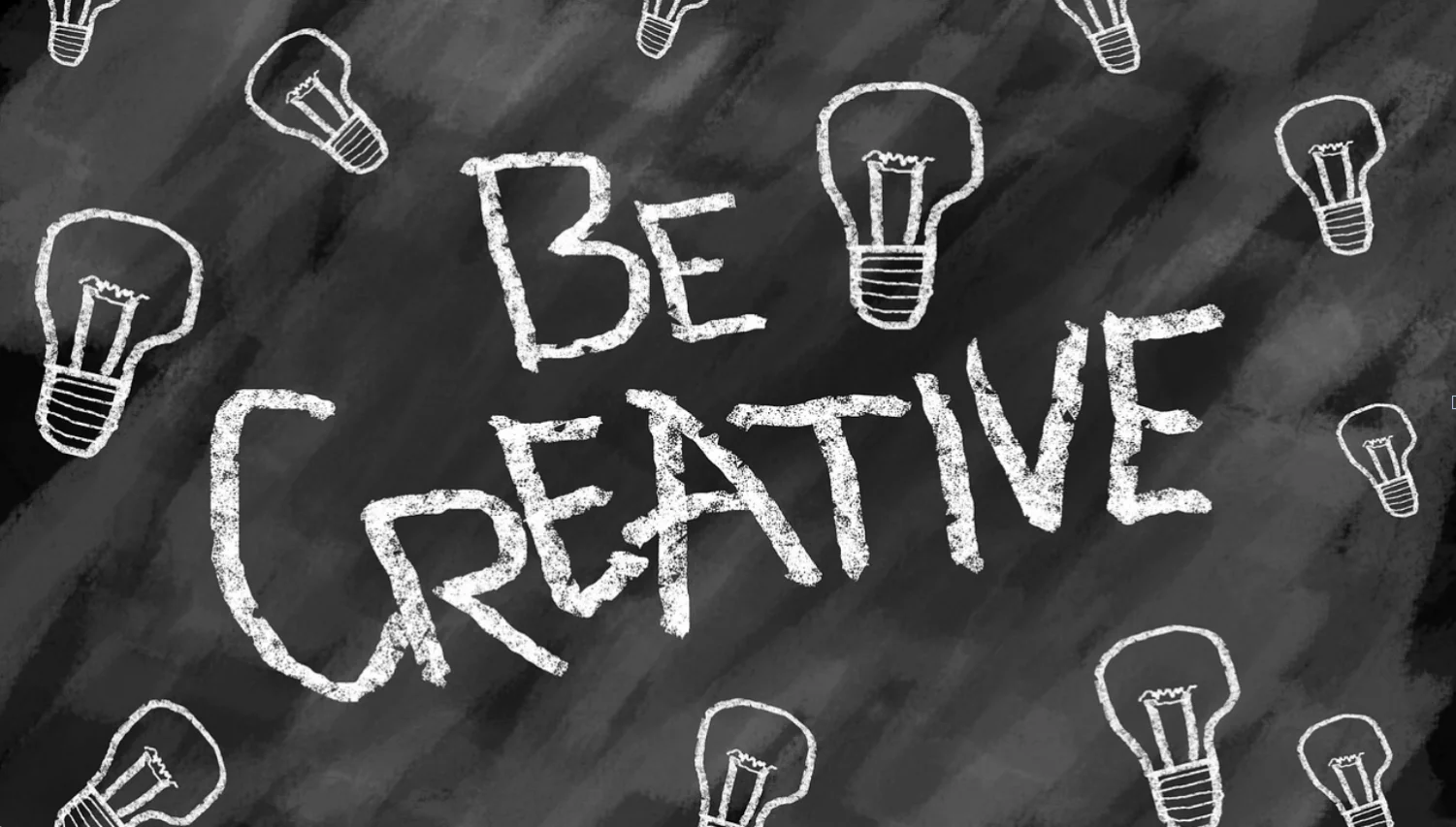 A picture of a chalkboard with some light bulbs and the words BE CREATIVE written on it.