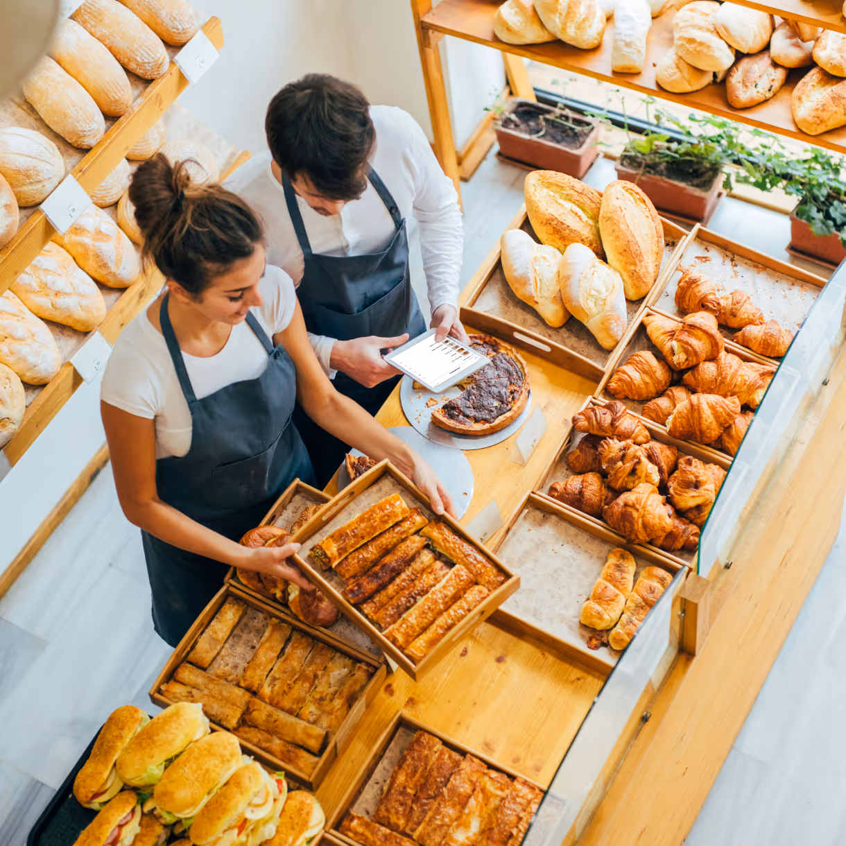 two bakers reviewing sales data
