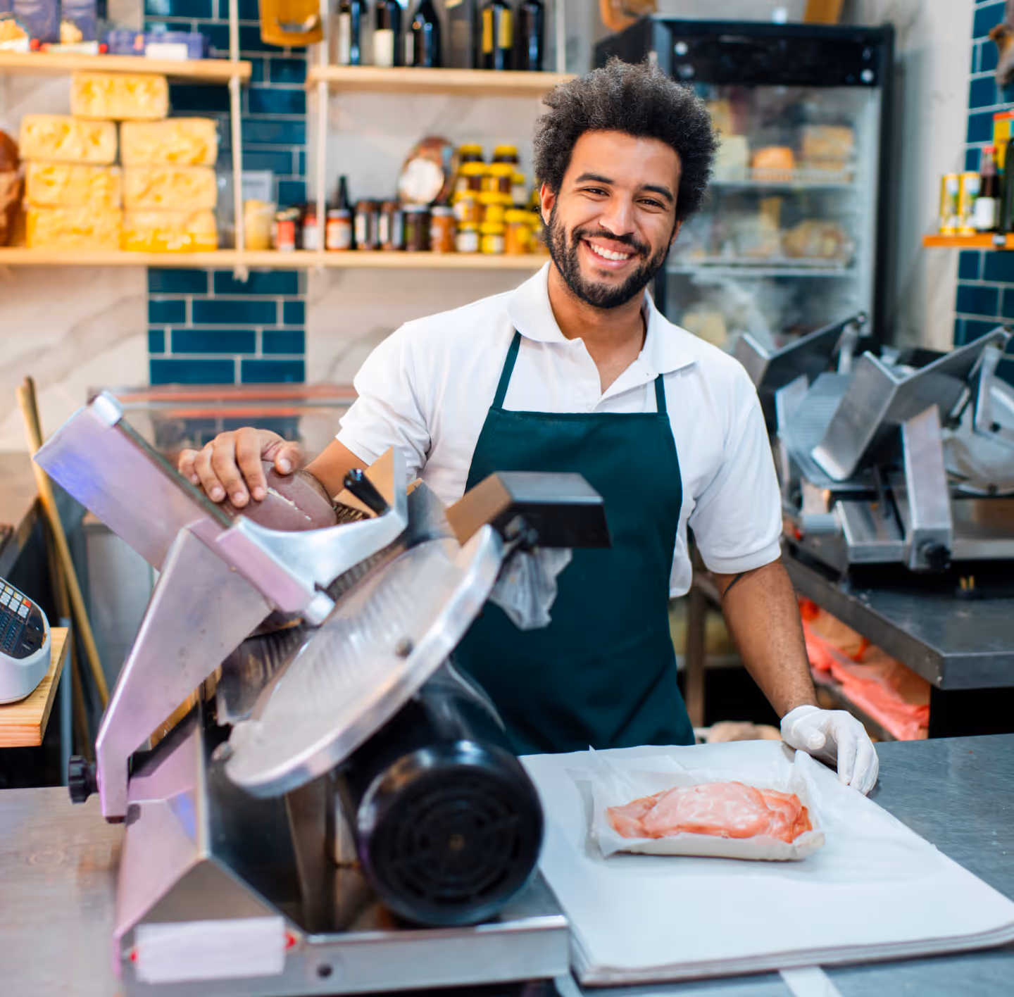 a worker inside a deli shop