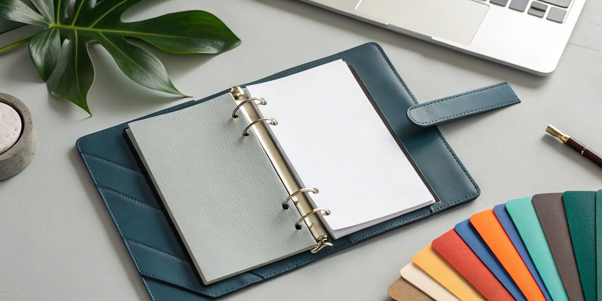 A franchise bible in the process of creation, with an open planner, notes, and color palettes.