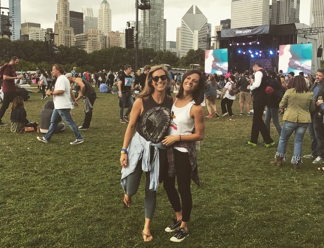 Two girls smiling at the music festival Lollapalooza