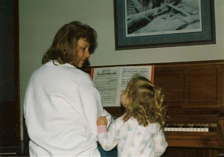  Amy getting one of her first piano lessons from her mom in 1995