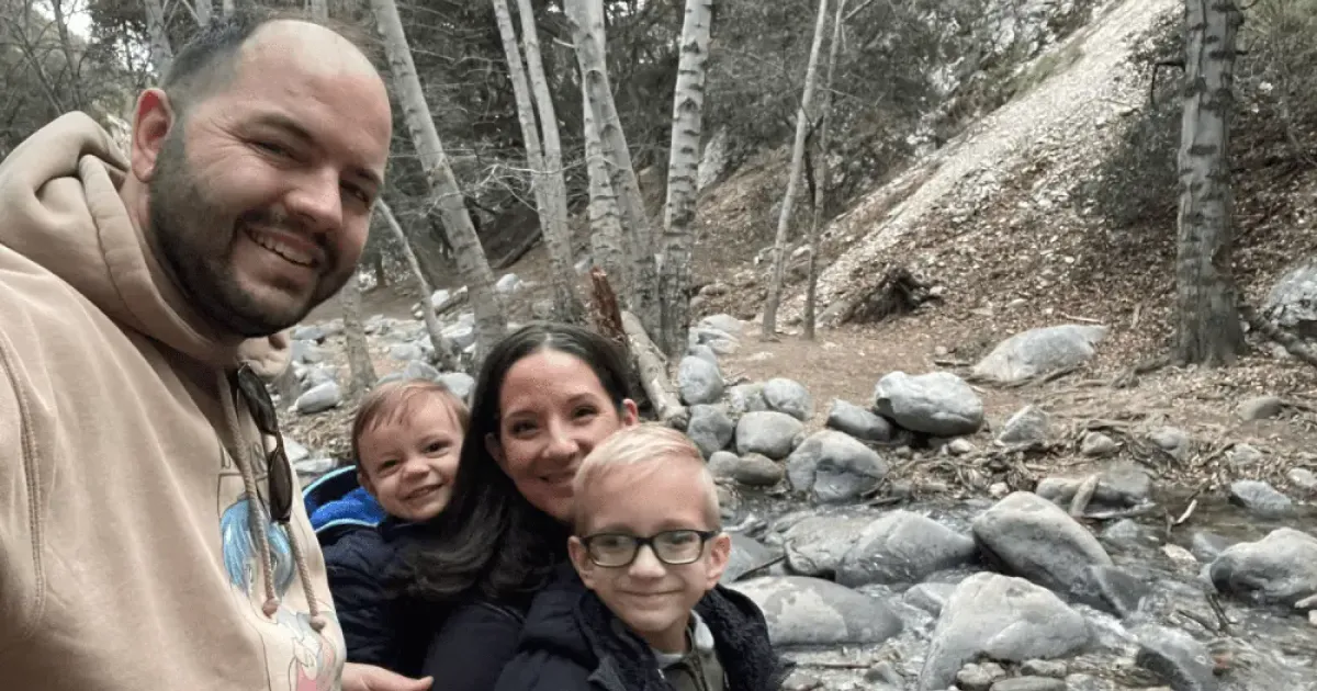 David and family hiking near a stream