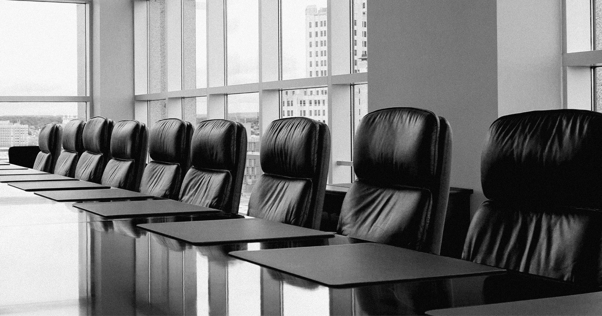 corporate boardroom with empty seats