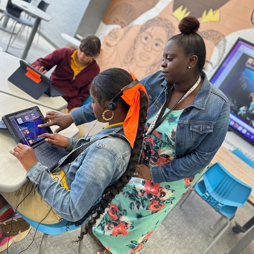 teacher showing student Kai XR on computer