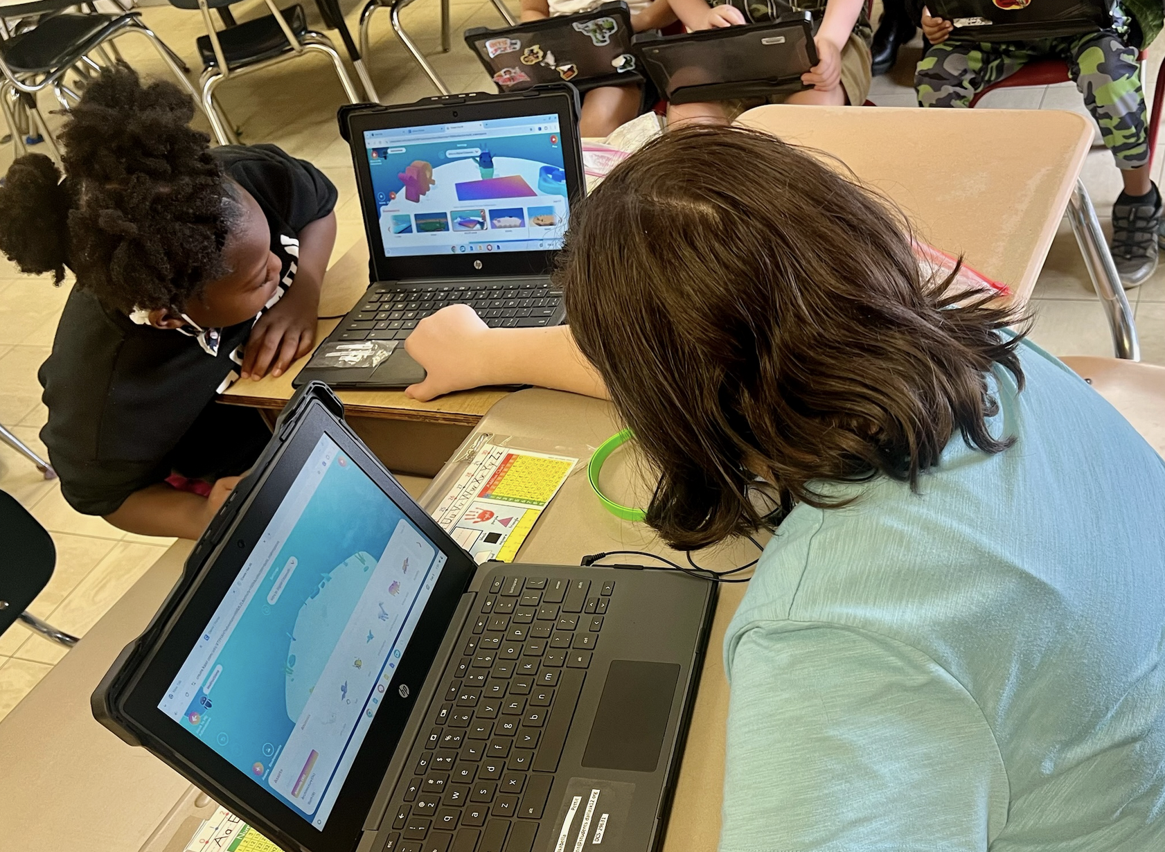 Smiling child wearing a KaiXR virtual reality headset and holding a VR controller, with blurred children in the background.