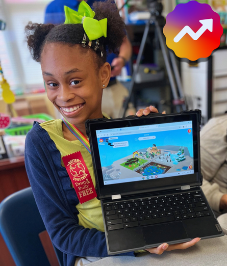 Smiling young girl with two green hair bows holding a laptop displaying a colorful digital map or game interface.