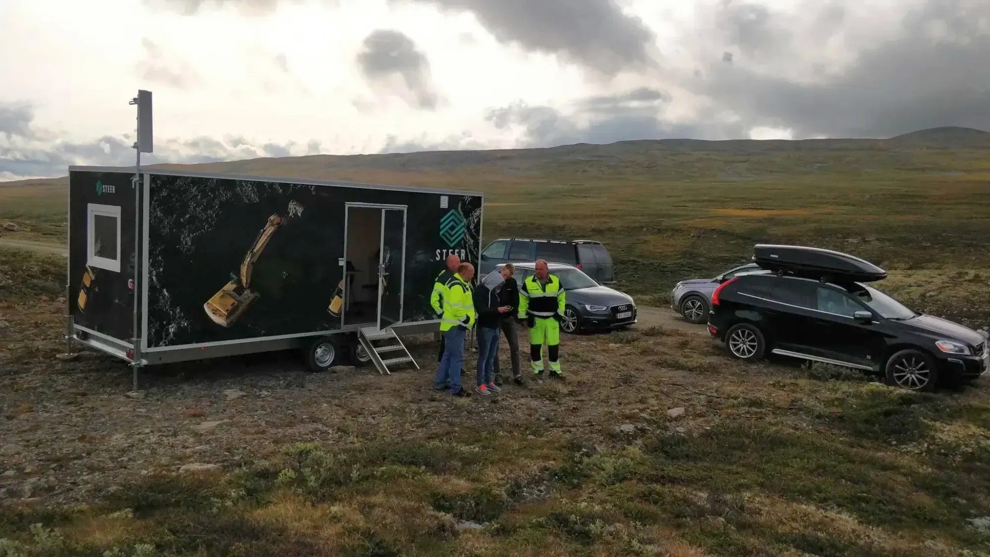 Mobile remote control unit for heavy machinery deployed in remote terrain with field team