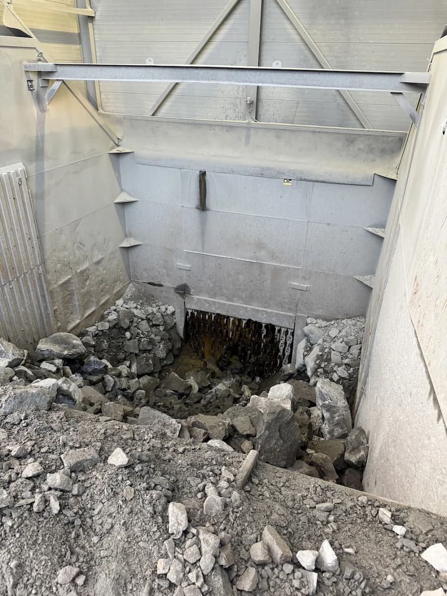 Underground facility with CAT D8 dozer and operators in high-visibility gear at Sibelco site