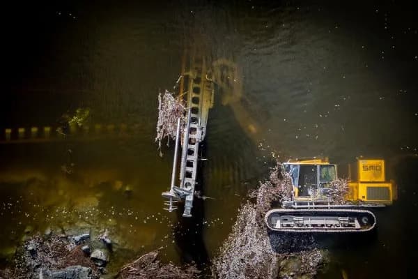 Aerial view of a landslide in quick clay deposits showing high-risk ground conditions and the need for remote-controlled heavy equipment.