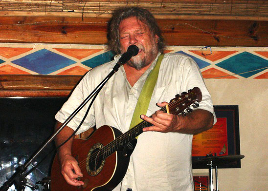 Sam Mieny, behind his guitar - the way so many knew him. Photo Paul van Jaarsveld