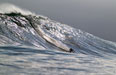 Jake Kolnik on a monster beast of a wave that is dropping below sea level. Photo: Peter Lambert.