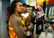Nonu and Vito check out surf footage at Natural Energy Surf Shop in the Strand. Ocean Minded sponsored the boys some sandals. Photo: Ina Karabasz