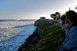 Spectators line the cliffs as another monster set rolls in.