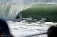 An unknown Bodyboarder dodges traffic at North Beach. Photo: Fay Klusener