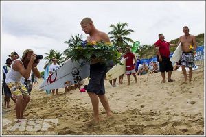 A grim Fanning walks down the beach. Photo: ASP / Kirsten Scholtz