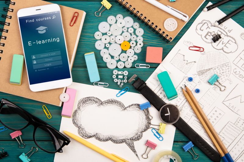 People conferring with laptop