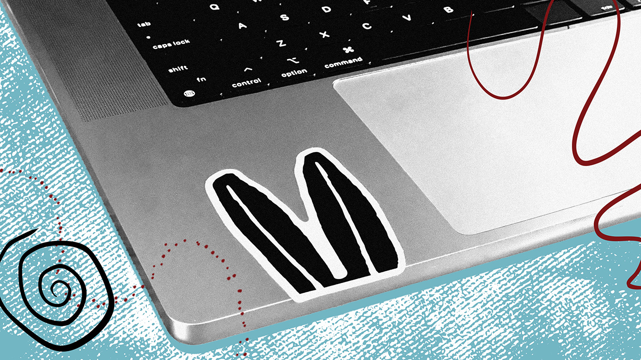 Close up photo of laptop with Heard branding stickers