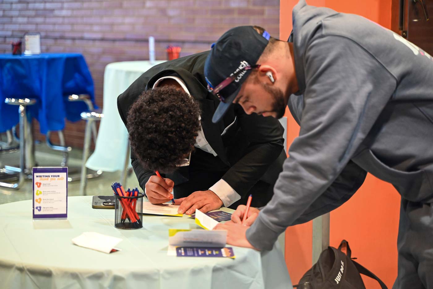 Baruch students writing notes of gratitude